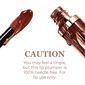 Luminess Cosmetics Hot Kiss Brown Sugar Lip Plumper applicator and product bottle with caution message stating the lip plumper may cause a tingling sensation and is 100% needle free. image number null